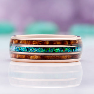 Close-up of the whiskey barrel wood grain and peacock opal inlay
