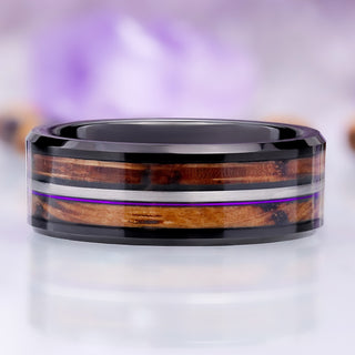 Whiskey barrel and purple fishing line men's wedding band in black tungsten, 8mm, two oak inlays divided by a brushed rail with a purple line