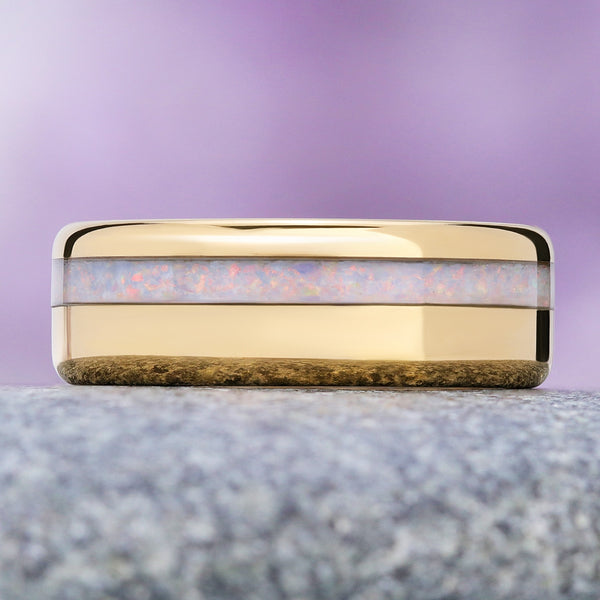 White fire opal men's wedding band in polished yellow gold tungsten, 8mm, crushed opal channel flashing pink and blue