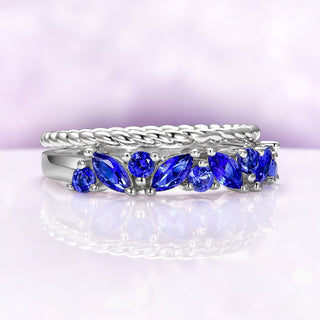 Willow Ceylon Blue Sapphire Stacking Ring Set in Sterling Silver by Aquamarise, featuring vibrant blue sapphires with marquise and round cuts on delicate silver bands.