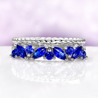 Willow Ceylon Blue Sapphire Stacking Ring Set in Sterling Silver by Aquamarise, featuring marquise and round blue sapphires in intertwined sterling silver bands.