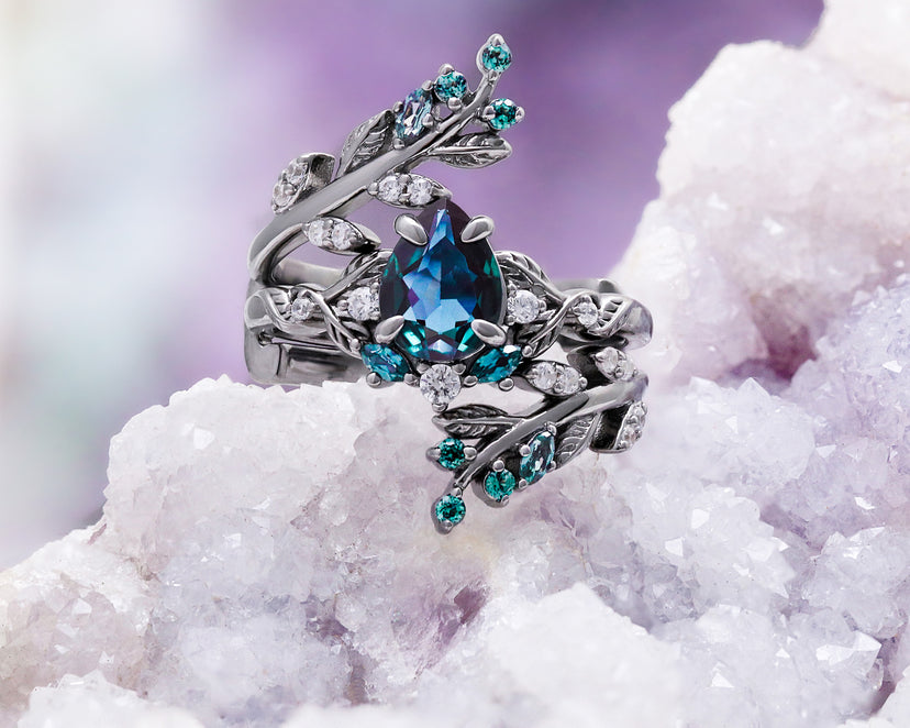 Wisteria alexandrite fairy leaf ring in black ruthenium on a geode