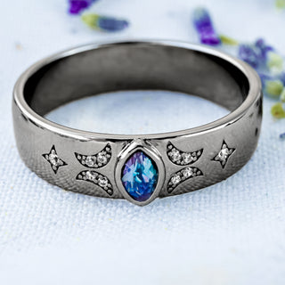 Alexandrite Celestial Wedding Band in Black Ruthenium (6mm) on a bed of lavender