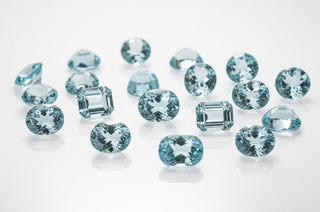 Collection of blue gemstones on a white background