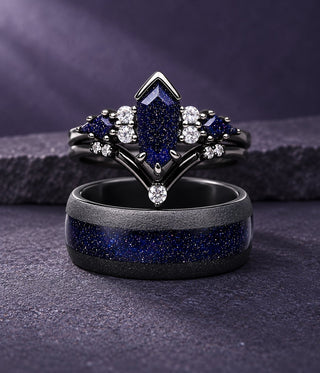 Couples ring set on a purple stone ledge: black kite-cut blue sandstone engagement ring with chevron band stacked on a black men's band with blue sandstone inlay, Aquamarise banner