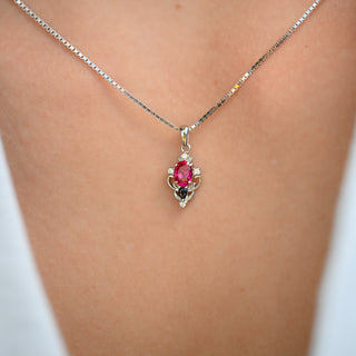 Model wearing the Carmilla lab-grown ruby and black onyx pendant necklace in sterling silver