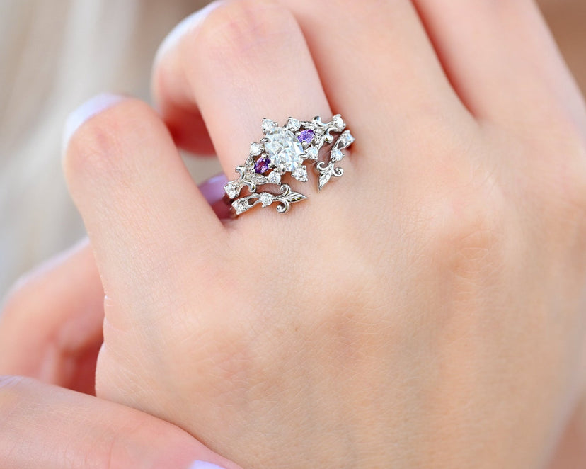 Carmilla Oval Moissanite and Amethyst engagement ring with the Leaf and Vine enhancer worn on the hand, cropped for the homepage hero