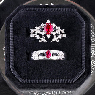 Carmilla ruby and black onyx couples rings presented together in a black velvet ring box