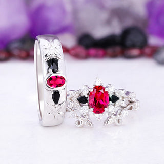 Carmilla lab-grown ruby and black onyx couples ring set in sterling silver, the 6mm band standing beside the leaf and vine bridal ring