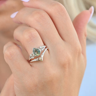 Celtic knot moss agate ring set worn on a model's hand
