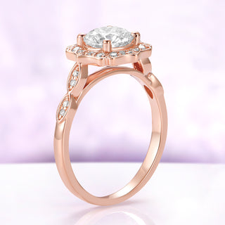 Side profile of the Cordelia lab-grown diamond ring, showing the low-set halo and the open gallery beneath the center stone in solid rose gold
