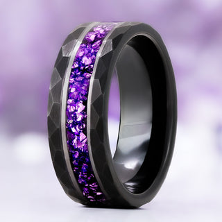 Crushed Amethyst men's wedding band in hammered black tungsten, 8mm, standing upright with a silver-edged purple amethyst channel