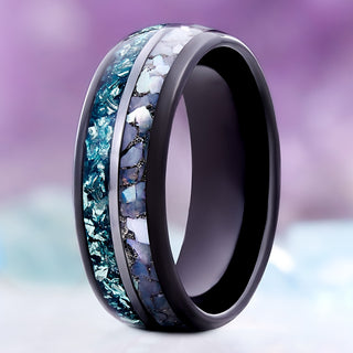 Standing view of the crushed aquamarine and pearl black tungsten band showing the dome profile and polished comfort-fit interior