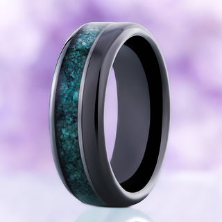 Standing view of the 8mm black tungsten men's wedding band with crushed green moss agate inlay and beveled edges