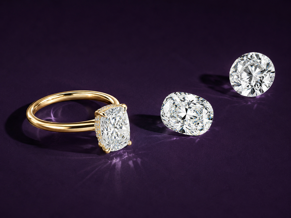 Diamond engagement ring by Aquamarise shown in a soft-focus collection banner