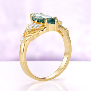 Side profile of the Eilwen moss agate leaf ring, showing how low the elongated marquise sits in its six prongs above the gold vermeil band
