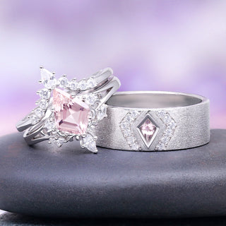 Two silver rings with pink gemstones on a gray surface with a purple gradient background