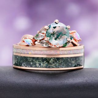 Enchanted Garden couples ring set stacked, rose gold moss agate and opal engagement ring resting on the men's band with white opal and moss agate inlays