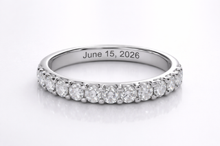 Diamond ring with engraved date 'June 15, 2026' on a white background