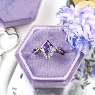 Faelyn Kite Lab-Grown Alexandrite Fairy Engagement Ring in Sterling Silver in a lilac velvet ring box with a heart key