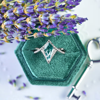 Faelyn Kite Moss Agate Fairy Engagement Ring in Sterling Silver in a teal velvet ring box with a heart key