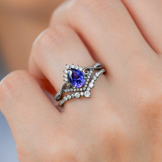 Faye Cornflower Sapphire Engagement Ring Set in Black Ruthenium worn on the hand