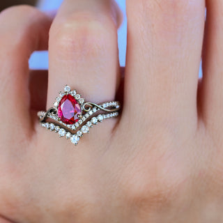 Faye ruby engagement ring set in black ruthenium worn on a model's hand