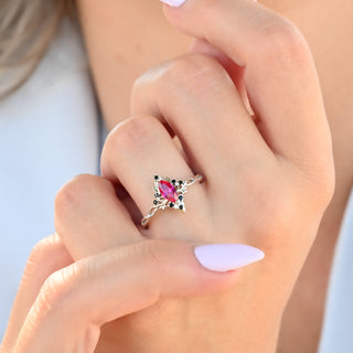 Fire Queen marquise ruby and black onyx ring worn on a model's hand