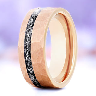 Galaxy meteorite men's wedding band in hammered rose gold tungsten, 8mm, standing view showing the crushed meteorite channel and faceted finish