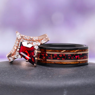 garnet couples ring set with fire opal tungsten wedding band on gray surface over purple background