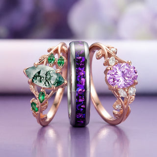 Three ornate rings with gemstones on a purple background