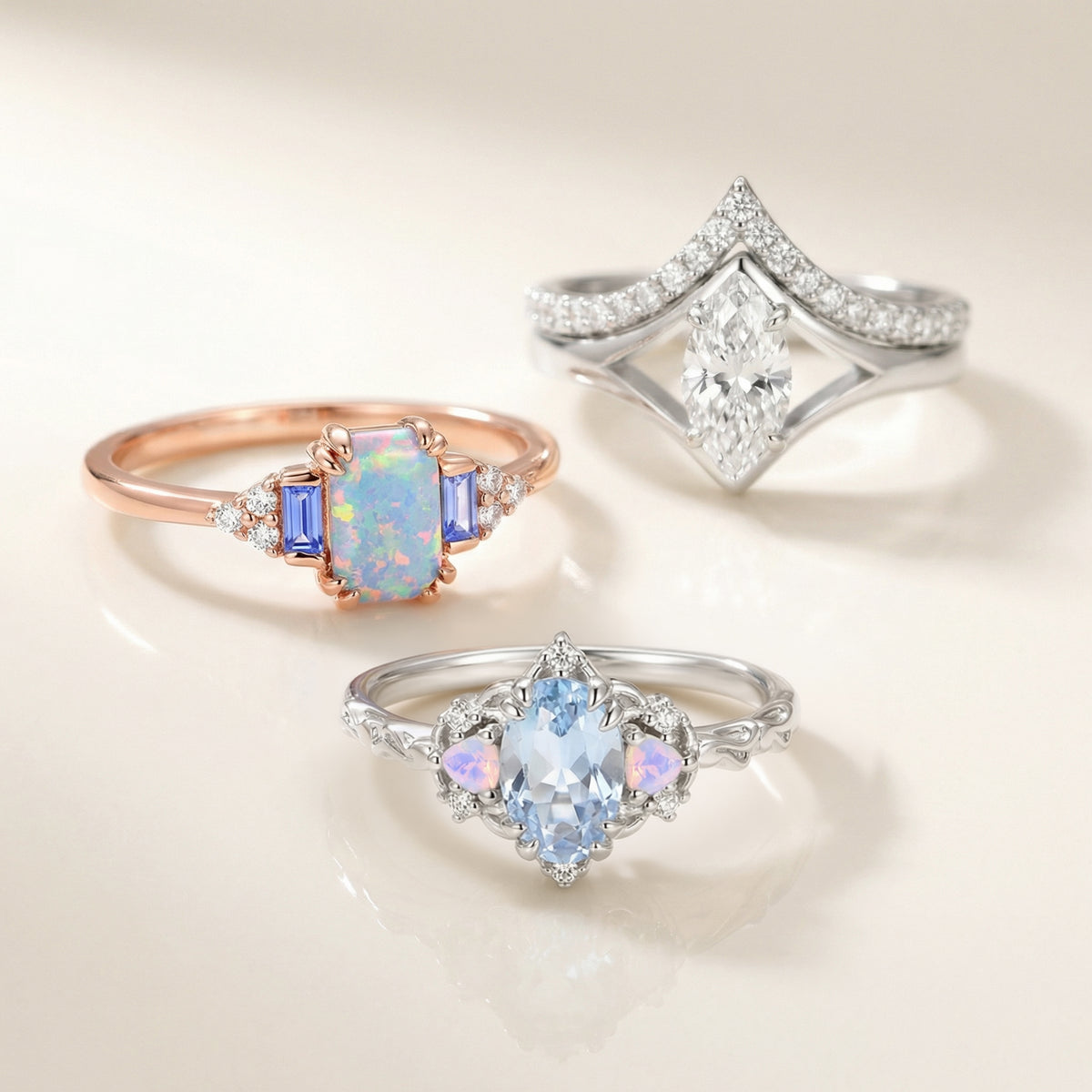 Opal, aquamarine and diamond rings by Aquamarise