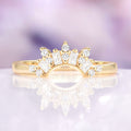 Yellow gold stacking diamond wedding band on purple background 