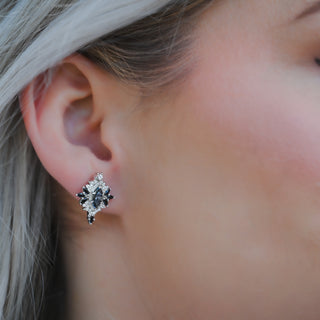 Model wearing the Nightbriar gray moissanite and black onyx stud earring in sterling silver