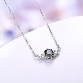 Gray moissanite cluster necklace shown at an angle with its 18 inch sterling silver cable chain