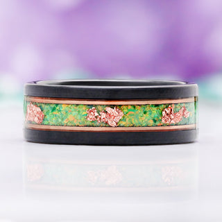 Front view of the 8mm Green Fire Opal and rose gold leaf men's wedding band in two-tone tungsten with rose gold rails