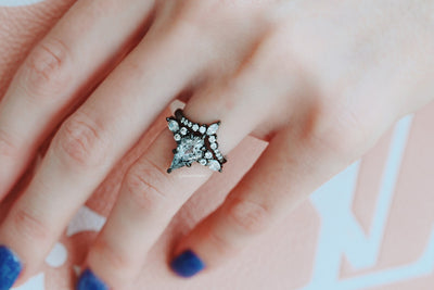 Skye Kite Galaxy Herkimer diamond ring set in black ruthenium by Aquamarise, worn on a hand