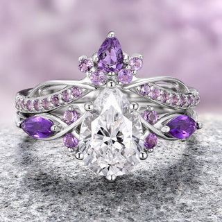 A lab-grown diamond and amethyst ring set in 14K white gold, featuring a teardrop-shaped center diamond surrounded by a halo of round amethyst stones on a textured background.