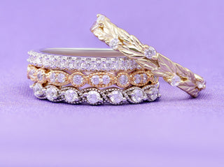 Stacked pave eternity bands in silver, rose gold and yellow gold with a gold leaf vine band on lilac, Aquamarise Labor Day sale mobile banner