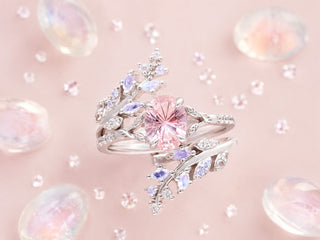 Sterling silver oval morganite fairy leaf engagement ring stacked with a moonstone leaf enhancer band among tumbled moonstones on blush pink, Aquamarise banner