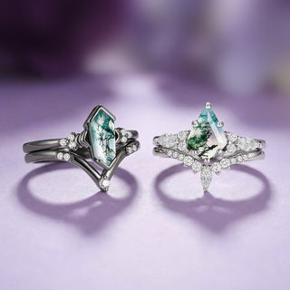 Two silver rings with green gemstones on a purple background