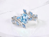 Moss agate leaf engagement ring by Aquamarise shown in a ring style banner