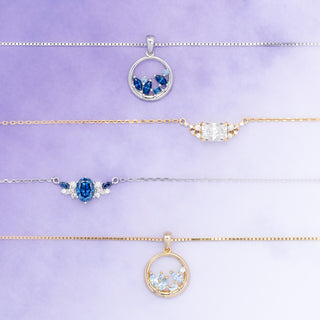 Jewelry set with pendants on a light purple background