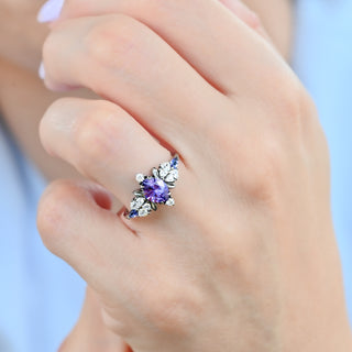 Noraleaf lab-grown purple sapphire engagement ring in black ruthenium worn on a model's hand