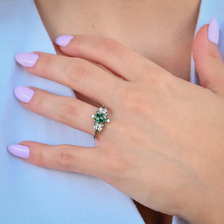 Noraleaf Marquise Moss Agate Engagement Ring in Black Ruthenium worn on the hand