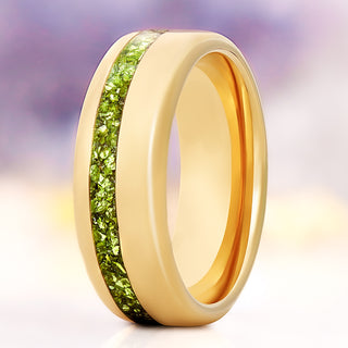 Off-set crushed peridot men's wedding band in polished gold tungsten, 8mm, standing view showing the green inlay channel and gold interior