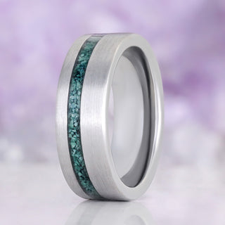 Men's 8mm brushed tungsten wedding band with a natural moss agate inlay set off-centre in the band