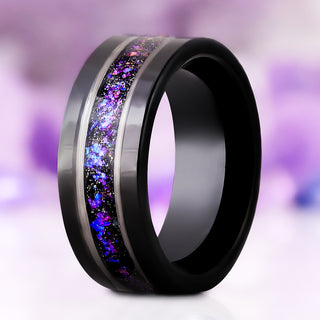 Orion Nebula Fire Opal men's wedding band in black tungsten carbide, 8mm, standing upright with the silver-edged off-set channel of purple and blue nebula opal