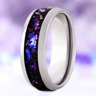 Orion Nebula Fire Opal men's wedding band in polished silver tungsten carbide, 8mm, standing upright with the off-set channel of purple, pink and blue nebula opal