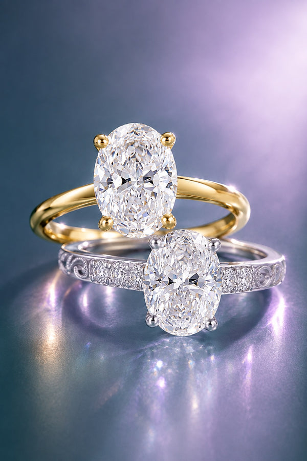 Yellow gold oval moissanite solitaire engagement ring above a white gold oval solitaire with a pave band, Aquamarise vertical collection banner